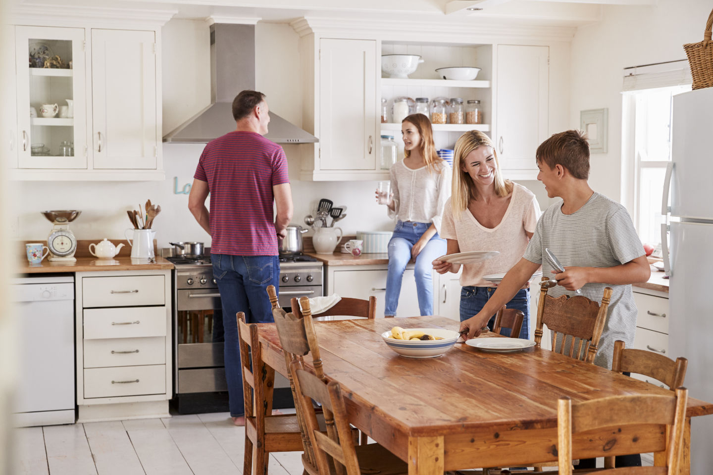 Family setting the table together