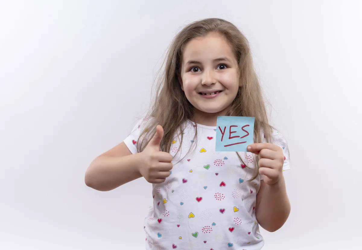 Child celebrating a completed chore with a yes note