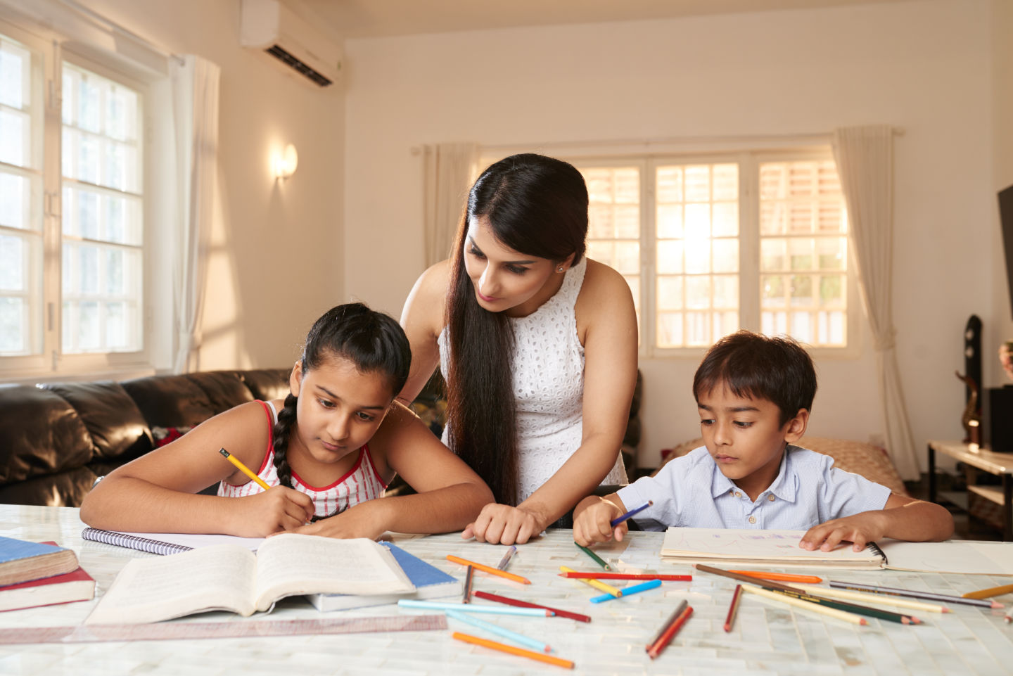 Mom helping kids with tasks
