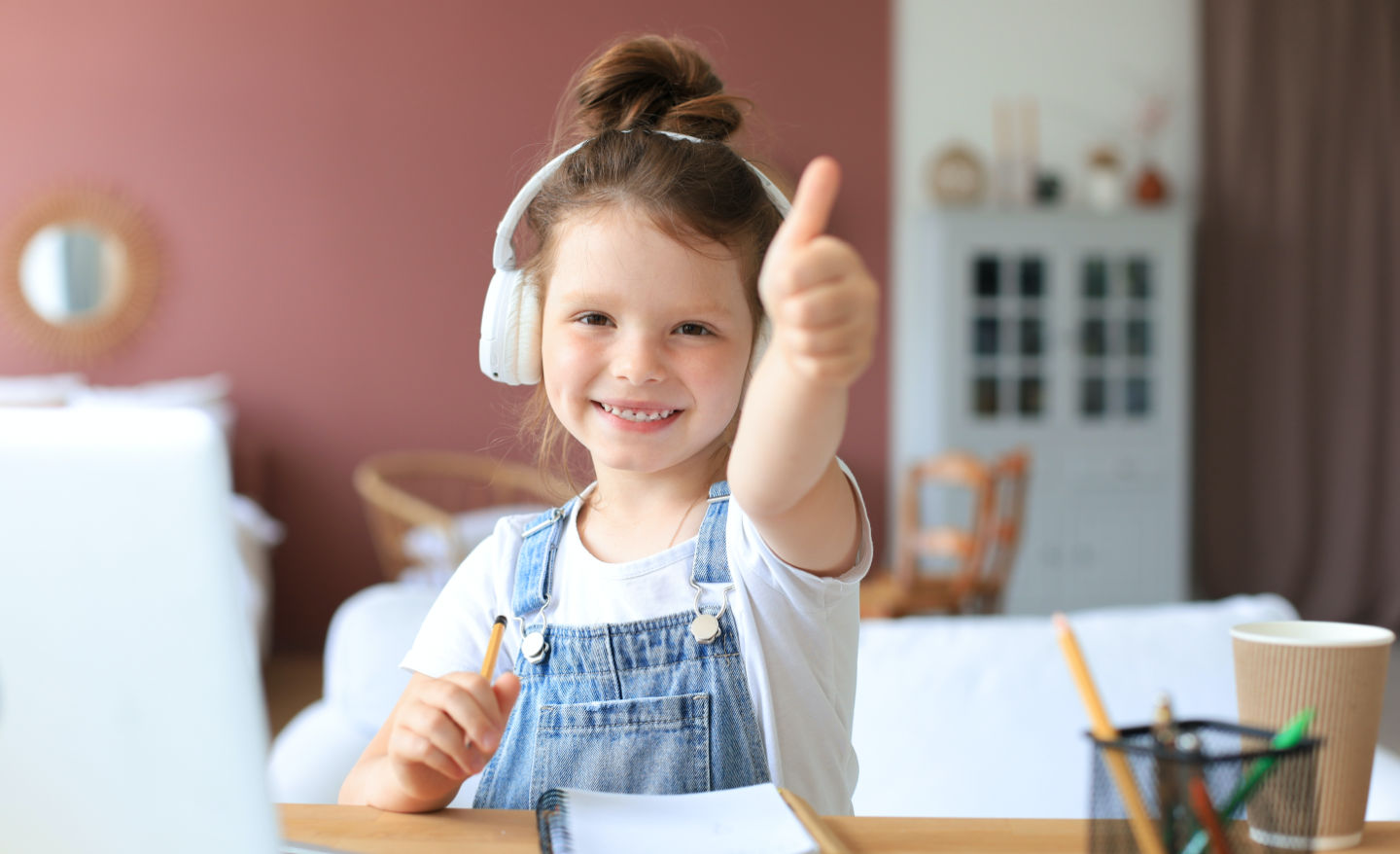 Kid giving thumbs up for a reward