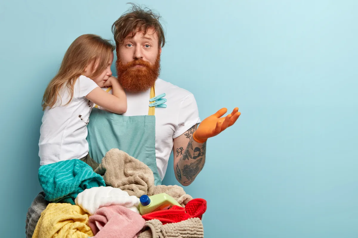 Overwhelmed parent sorting through a complicated chore system